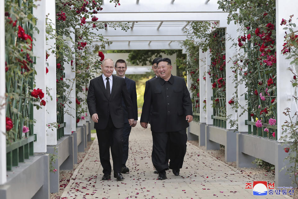 In this photo provided by the North Korean government, North Korean leader Kim Jong Un, right, and Russia's President Vladimir Putin, left, walk through a garden of the Kumsusan State Guest House in Pyongyang, North Korea Wednesday, June 19, 2024. Independent journalists were not given access to cover the event depicted in this image distributed by the North Korean government. The content of this image is as provided and cannot be independently verified. Korean language watermark on image as provided by source reads: "KCNA" which is the abbreviation for Korean Central News Agency. (Korean Central News Agency/Korea News Service via AP)