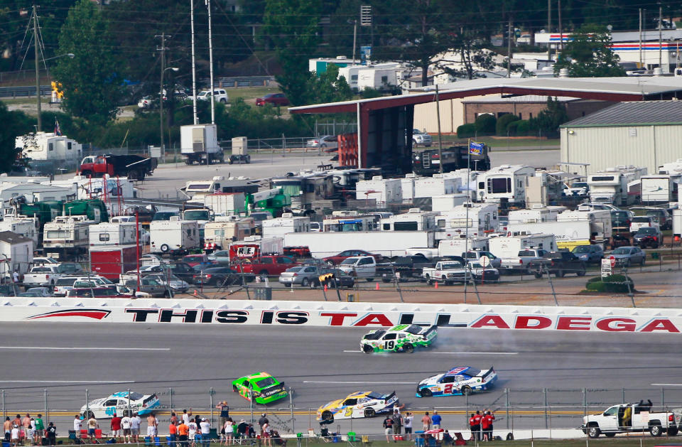 TALLADEGA, AL - MAY 05: Danica Patrick, driver of the #7 GoDaddy.com Chevrolet, Dale Earnhardt Jr., driver of the #5 Hellmann's Chevrolet, Elliott Sadler, driver of the #2 OneMain Financial Chevrolet, and Tayler Malsam, driver of the #19 G-Oil Toyota, are involved in an on track incident during the NASCAR Nationwide Series Aaron's 312 at Talladega Superspeedway on May 5, 2012 in Talladega, Alabama. (Photo by Kevin C. Cox/Getty Images for NASCAR)