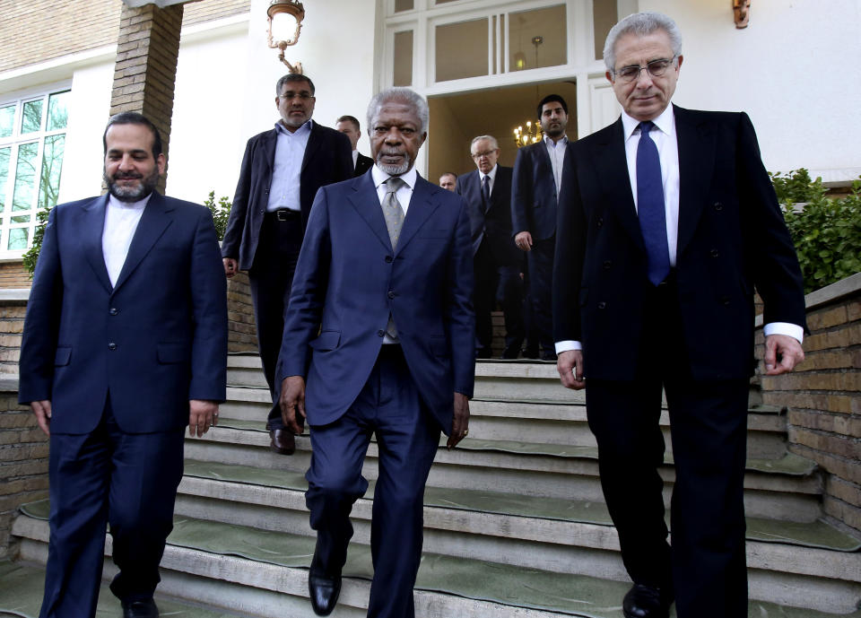 Former United Nations Secretary-General Kofi Annan, center, and Mexico's former President Ernesto Zedillo, right, leave after meeting with secretary of Iran's Supreme National Security Council, Ali Shamkhani in Tehran, Iran, Tuesday, Jan. 28, 2014. (AP Photo/Vahid Salemi)