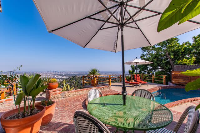 <p>Sergii Dolgyire</p> View of the Los Angeles skyline from the back patio and pool.