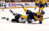 Nashville Predators center Colin Wilson (33) collides with San Jose Sharks center Logan Couture (39) during the overtime period in game four of the second round of the 2016 Stanley Cup Playoffs at Bridgestone Arena. Mandatory Credit: Aaron Doster-USA TODAY Sports