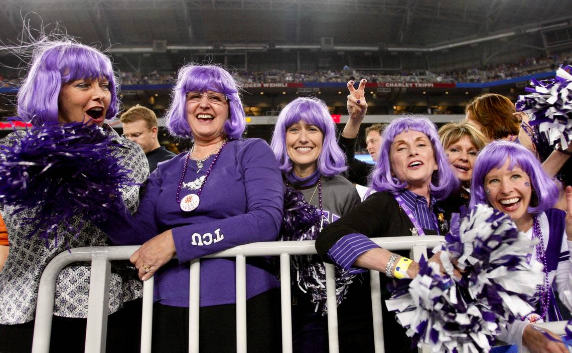 A group of TCU fans sporting purple wigs cheer on the team as Texas Christian University loses to Boise State 17-10 in the Tostitos Fiesta Bowl in Glendale, Arizona, Monday January 4, 2010.