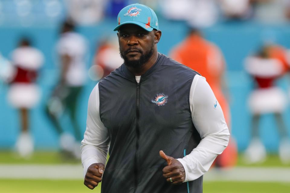 Dec 19, 2021; Miami Gardens, Florida, USA; Miami Dolphins head coach Brian Flores runs off the field after winning the game against the <a class="link " href="https://sports.yahoo.com/nfl/teams/ny-jets/" data-i13n="sec:content-canvas;subsec:anchor_text;elm:context_link" data-ylk="slk:New York Jets;sec:content-canvas;subsec:anchor_text;elm:context_link;itc:0">New York Jets</a> at Hard Rock Stadium. Mandatory Credit: Sam Navarro-USA TODAY Sports