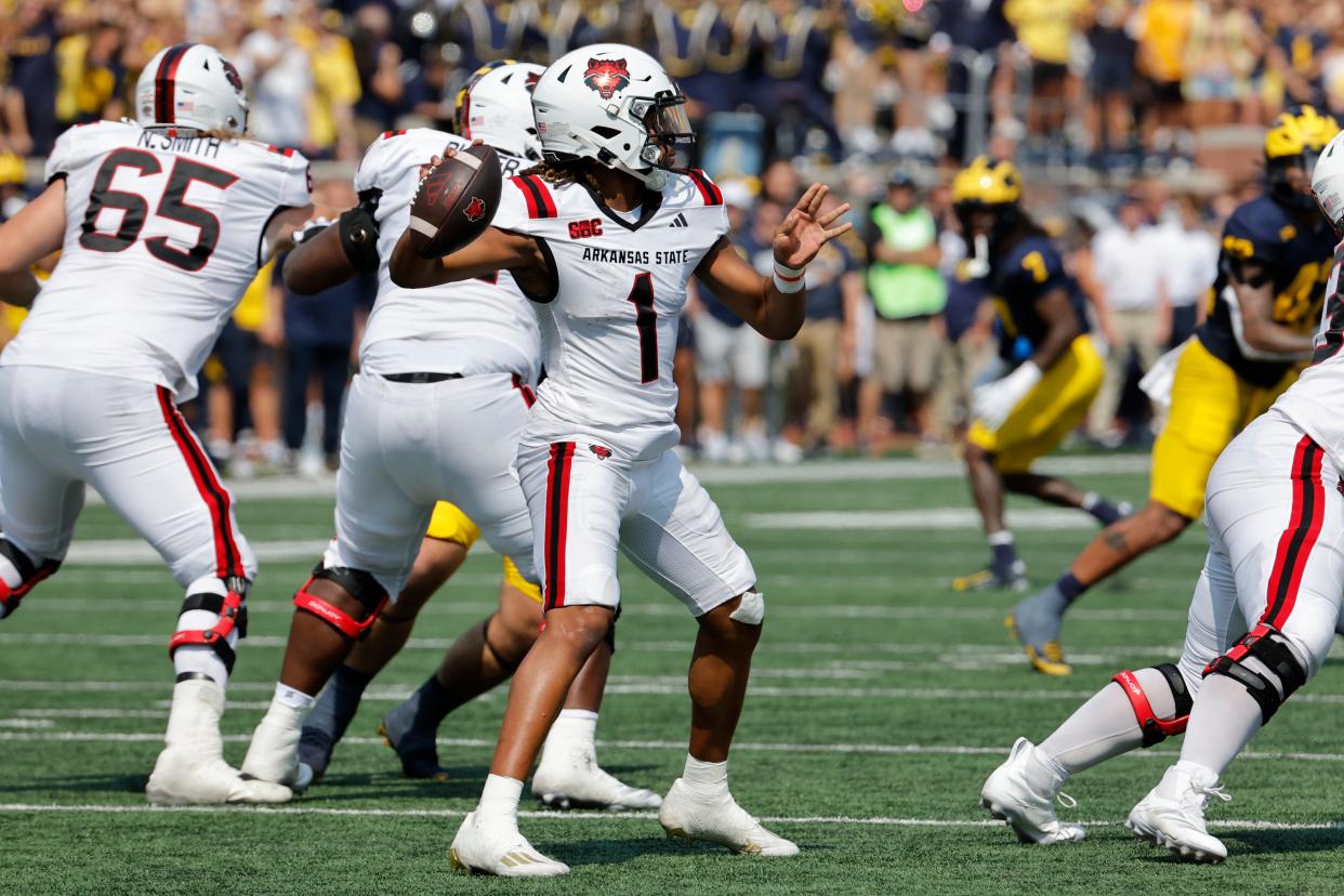 Arkansas State Red Wolves quarterback Jaylen Raynor throws against the Michigan Wolverines during the first half at Michigan Stadium in Ann Arbor on Saturday, Sept. 14, 2024.