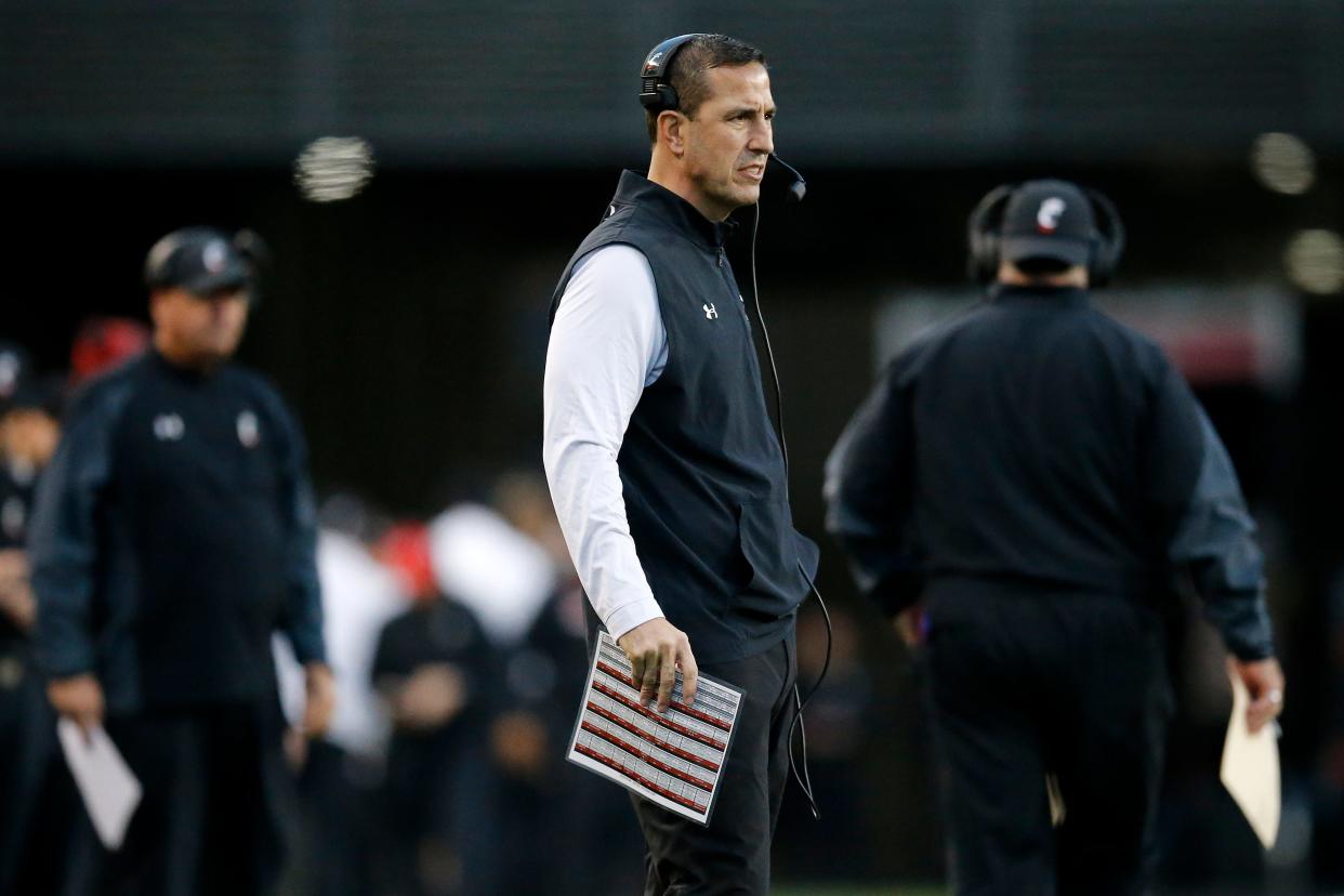 Cincinnati Bearcats head coach Luke Fickell looks on from the sideline in the second quarter of the American Athletic Conference Championship football game between the Cincinnati Bearcats and the Houston Cougars at Nippert Stadium in Cincinnati on Saturday, Dec. 4, 2021. The Bearcats led 14-13 at the half. 