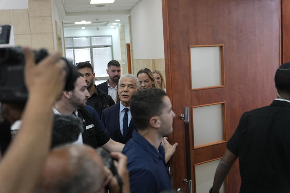 Israeli opposition leader Yair Lapid arrives to testify at the trial of Prime Minister Benjamin Netanyahu on corruption charges at the Jerusalem District Court, in east Jerusalem, Monday, June 12, 2023. (AP Photo/Ohad Zwigenberg)