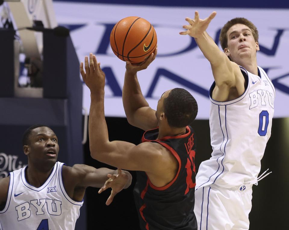 Brigham Young Cougars forward Atiki Ally Atiki (4) and Noah Waterman (0) double-team San Diego State Aztecs forward Jaedon LeDee (13) at BYU’s Marriott Center in Provo on Friday, Nov. 10, 2023. | Laura Seitz, Deseret News