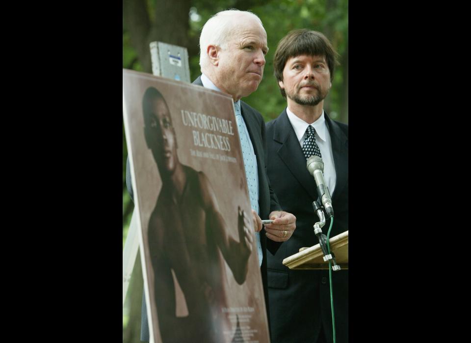 WASHINGTON - JULY 13:  U.S. Senator John McCain (R-AZ) (C) speaks as documentary filmmaker Ken Burns (R) looks on during a media conference to discuss a legal petition seeking a posthumous presidential pardon for former boxer Jack Johnson July 13, 2004 in Washington, DC. The petition, which was prepared by the law firm Proskauer Rose, and based on findings from Burns' upcoming film on the life of Jack Johnson, concludes that the 1913 conviction of Johnson for violating the Mann Act was 'discriminatory in intent and conclusion.'  (Photo by Alex Wong/Getty Images)