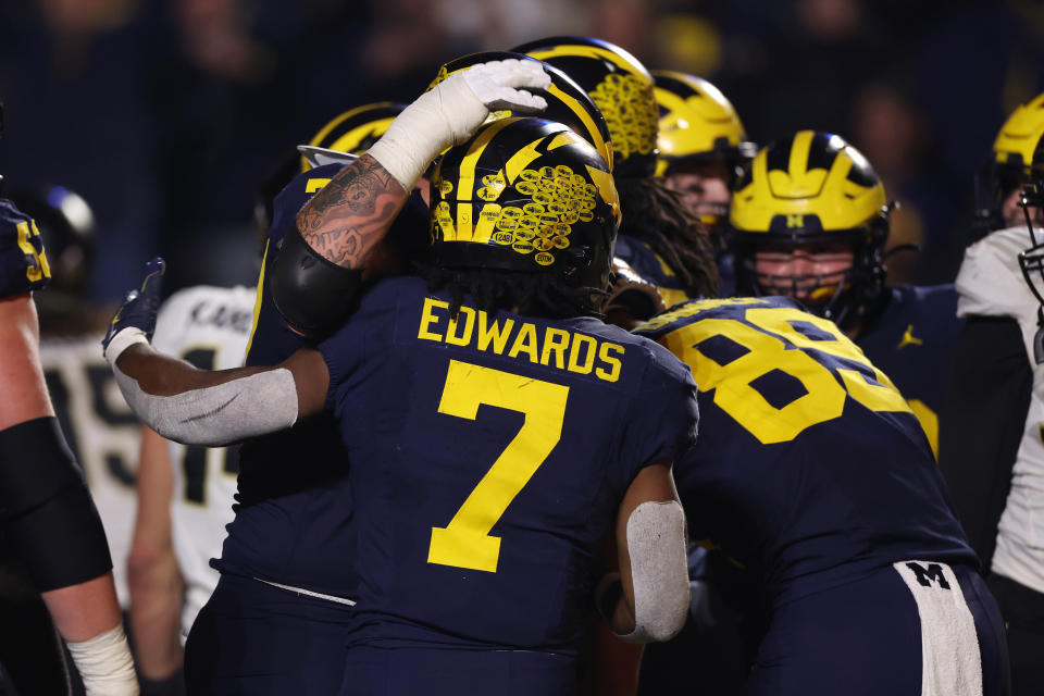 ANN ARBOR, MICHIGAN - NOVEMBER 04: Donovan Edwards #7 of the Michigan Wolverines celebrates his second half touchdown with teammates while playing the Purdue Boilermakers at Michigan Stadium on November 04, 2023 in Ann Arbor, Michigan. Michigan won the game 41-13. (Photo by Gregory Shamus/Getty Images)