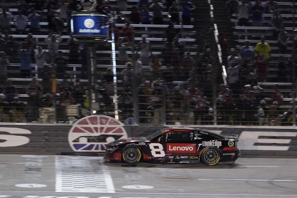 Tyler Reddick crosses the finish line winning the the NASCAR Cup Series auto race at Texas Motor Speedway in Fort Worth, Texas, Sunday, Sept. 25, 2022. (AP Photo/Larry Papke)