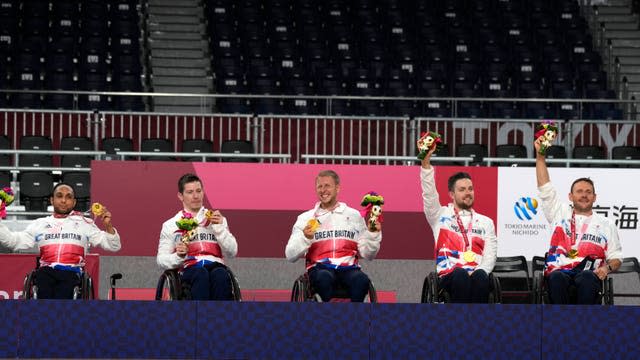 Britain's wheelchair rugby players celebrate with their gold medal during the awarding ceremony