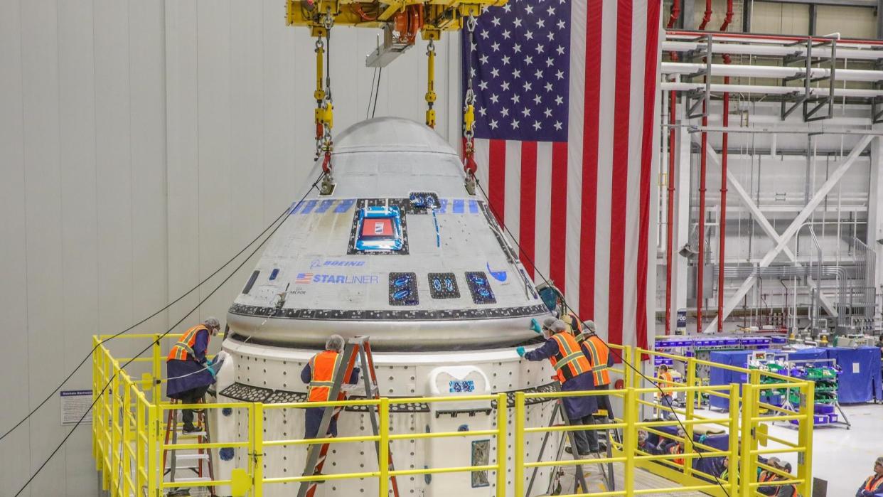  The Starliner team works to finalize the mate of the crew module and new service module for NASA's Boeing Crew Flight Test that will take NASA astronauts Barry "Butch" Wilmore and Sunita "Suni" Williams to and from the International Space Station. 