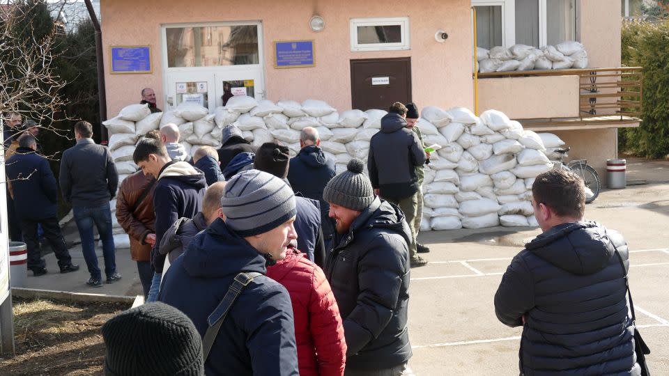 Volunteers, pictured on February 25, 2022, queue up outside the city's military registration and enlistment office to join the Territorial Defense Force, Ivano-Frankivsk, western Ukraine. - Yurii Rylchuk/ Ukrinform/Future Publishing/Getty Images