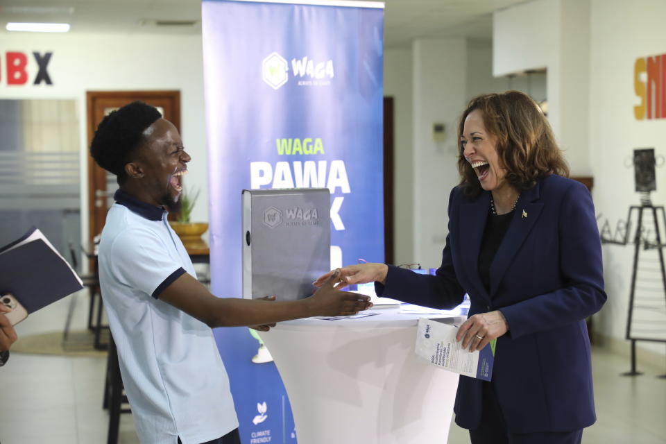 U.S. Vice President, Kamala Harris shares a light moment with Tanzanian climate entrepreneur, Gibson Kiwago at the SNDBX Space, a space for freelancers, entrepreneurs, builders, innovators and creatives, in Dar es Salaam, Tanzania, Thursday, March 30, 2023. (Ericky Boniphace/Pool Photo via AP)