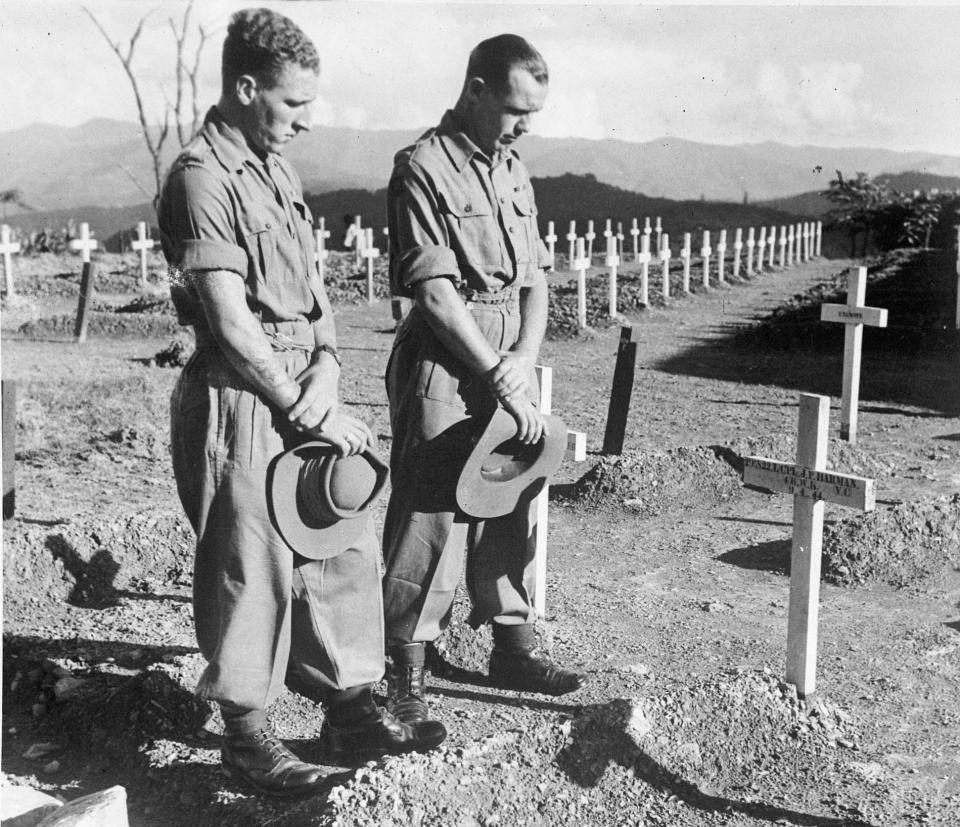 Comrades visit the grave of Lance Corporal John Harman VC, who was awarded the Victoria Cross posthumously for gallantry at Kohima during 8-9 April 1944. British soldiers who fought in the Far East during the Second World War became known as the 'Forgotten Army' - PA