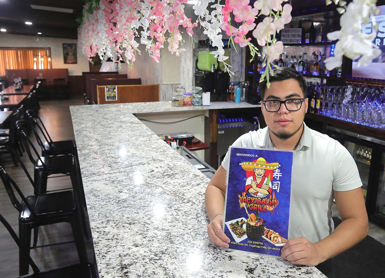 Mexibachi Grill co-owner Daniel Rodriguez shows off the newly renovated bar Aug. 1 in Cuyahoga Falls.