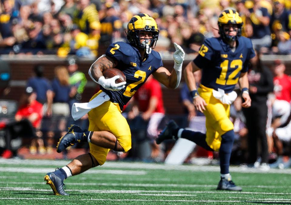 Michigan running back Blake Corum runs against Northern Illinois during the first half at Michigan Stadium in Ann Arbor on Saturday, Sept. 18, 2021.