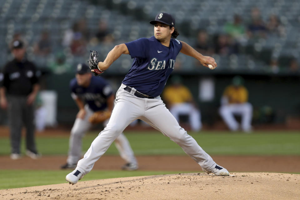 Seattle Mariners' Marco Gonzales throws against the Oakland Athletics during the first inning of a baseball game in Oakland, Calif., Tuesday, Sept. 21, 2021. (AP Photo/Jed Jacobsohn)