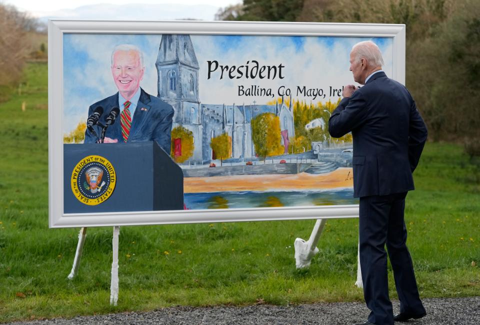 President Joe Biden looks at billboard with his likeness on it during a tour at the North Mayo Heritage Center in County Mayo, Ireland, Friday, April 14, 2023. (AP Photo/Patrick Semansky)