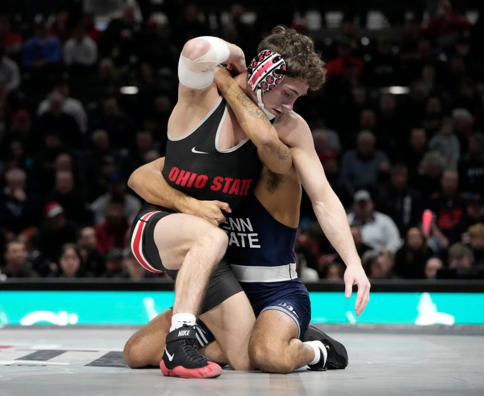 Jesse Mendez of Ohio State battles Penn State's Roman Bravo-Young. Mendez, a freshman, is 12-2 and ranked in the top 10 in the nation at 133 pounds.