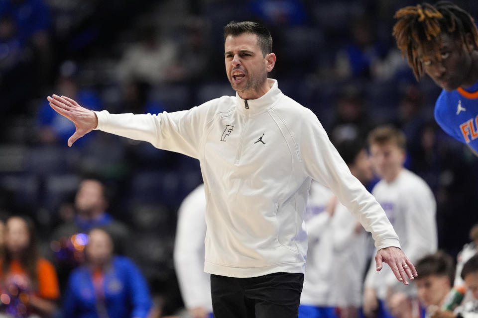 Florida head coach Todd Golden directs his team from the bench during the first half of an NCAA college basketball game against Alabama at the Southeastern Conference tournament Friday, March 15, 2024, in Nashville, Tenn. (AP Photo/John Bazemore)