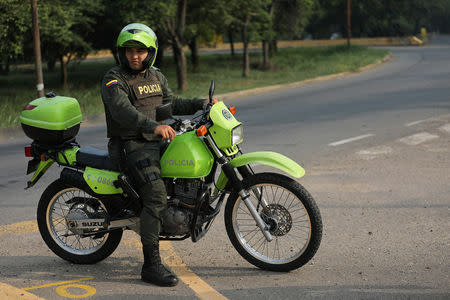 A police officer arrives on his motorcycle at the Tienditas cross-border bridge in Cucuta, Colombia, February 7, 2019. REUTERS/Luisa Gonzalez
