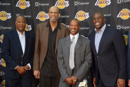 Jul 29, 2014; El Segundo, CA, USA; Byron Scott (second from right) poses for a photo with former Los Angeles Lakers players Jamaal Wilkes and Kareem Abdul-Jabbar and Magic Johnson at a press conference to announce Scott's hiring as Lakers coach at Toyota Sports Center. Kirby Lee-USA TODAY Sports