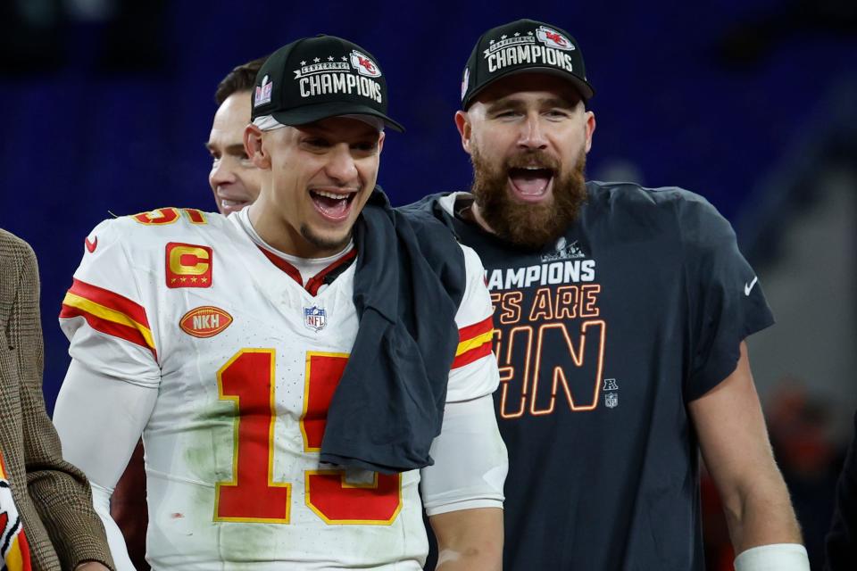 Kansas City Chiefs quarterback Patrick Mahomes (15) and tight end Travis Kelce (R) celebrate after their 17-10 win against the Baltimore Ravens in the AFC Championship.