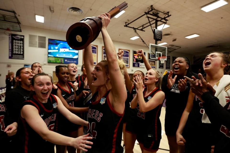 Transylvania’s Kennedi Stacy (24) and her teammates celebrate their victory against Wisconsin-Whitewater in the NCAA Division IIII Tournament’s Elite Eight.