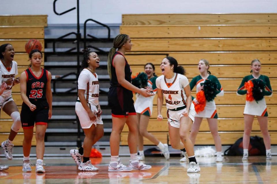 Frederick Douglass guard Niah Rhodes (4) celebrates scoring against George Rogers Clark during their game on Jan. 18.