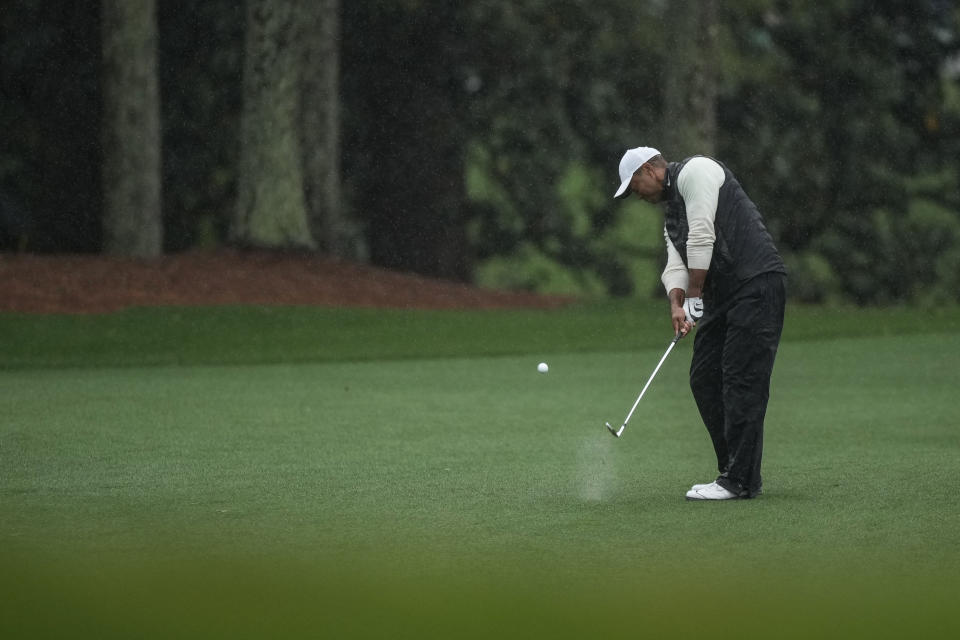 Tiger Woods hits from the fairway on the 18th hole during the weather delayed second round of the Masters golf tournament at Augusta National Golf Club on Saturday, April 8, 2023, in Augusta, Ga. (AP Photo/Matt Slocum)