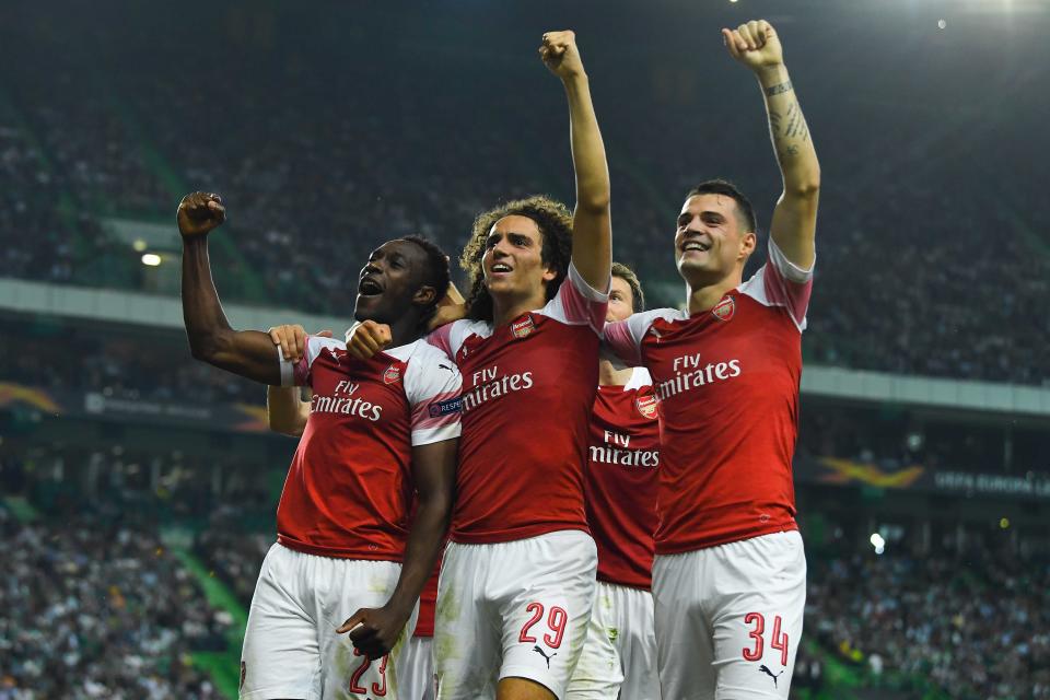 Arsenal players celebrate Danny Welbeck’s winner.