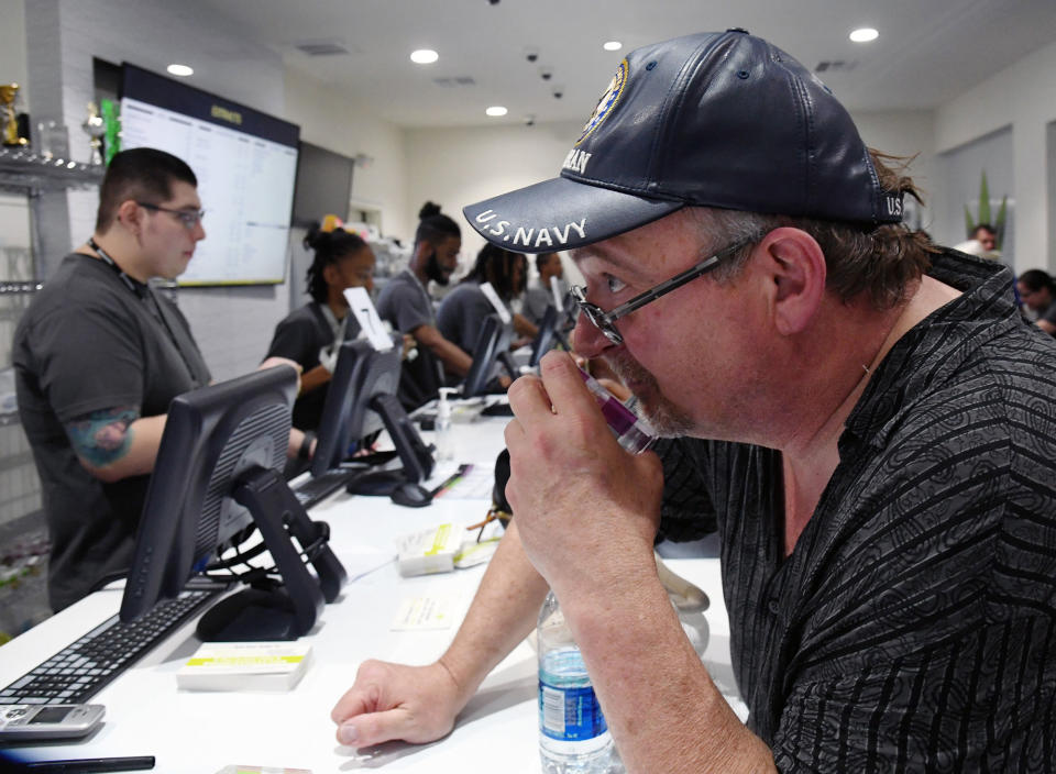 <p>Ken Butler of Colorado smells a cannabis sample Essence Vegas Cannabis Dispensary after the start of recreational marijuana sales began on July 1, 2017 in Las Vegas, Nev. (Photo: Ethan Miller/Getty Images) </p>