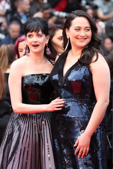 Eva Green and Lily Gladstone posing for a picture on the red carpet at the 77th annual Cannes Film Festival