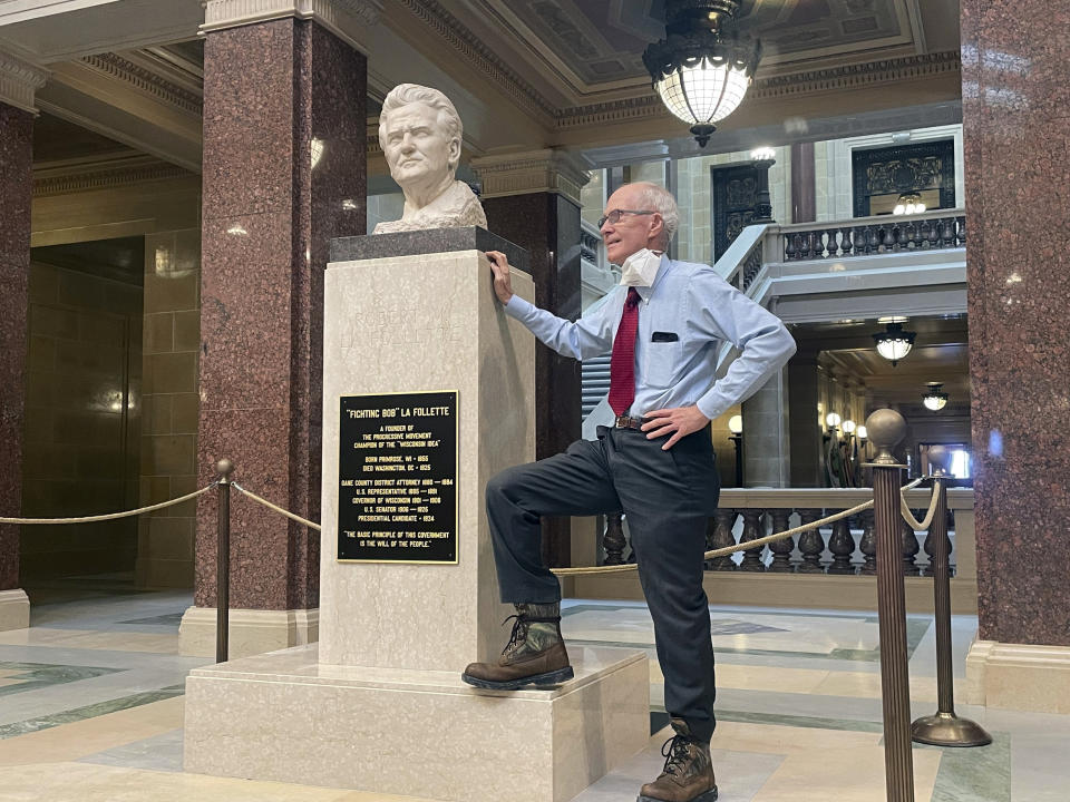 FILE - Wisconsin Secretary of State Doug La Follette unveils a plaque he helped pay for to honor his distant relative Robert "Fighting Bob" La Follette, one of the state's most famous politicians whose bust sits in the Capitol Rotunda, Jan. 30, 2023, in Madison, Wis. La Follette abruptly resigned on Friday, March 17, saying he was leaving three months into his 11th consecutive term “to focus on my personal needs” after watching the office be stripped of its power over the past 50 years. (AP Photo/Harm Venhuizen, File)