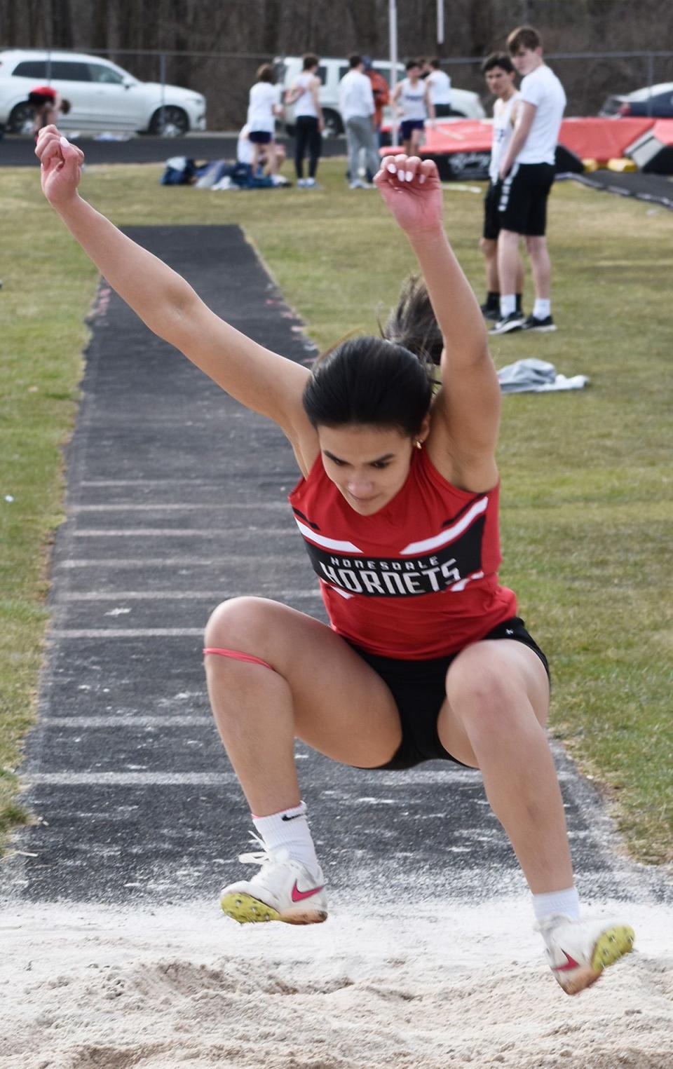 Rebecca Dadig of Honesdale soars to a solid finish in the triple jump Tuesday afternoon at the Daniel J. O'Neill Sports Complex.