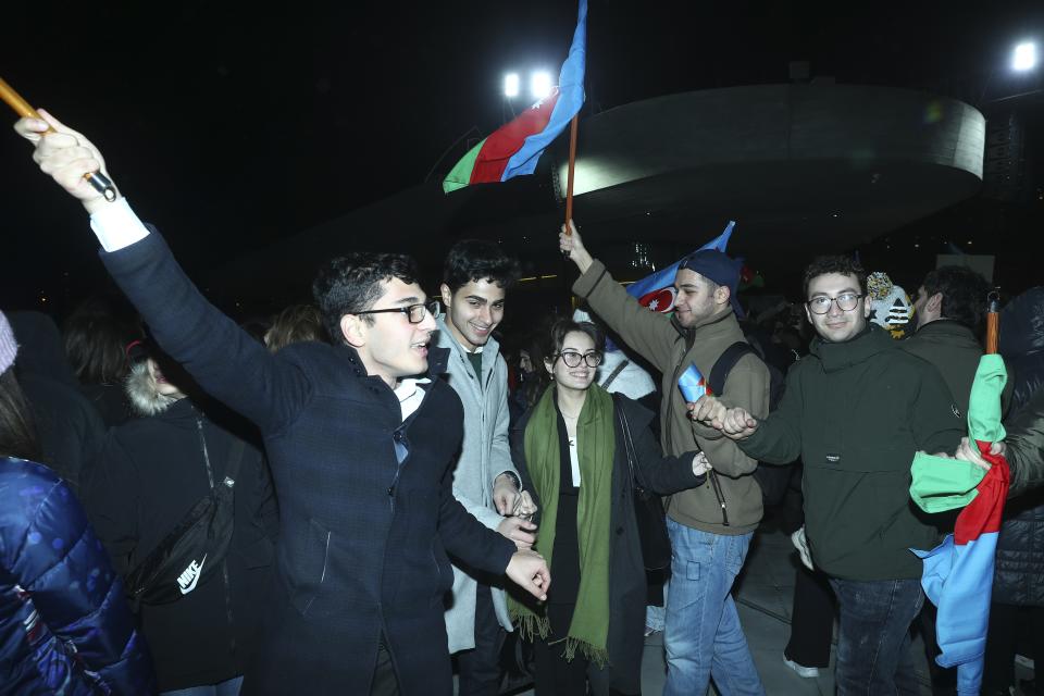 Youth dance celebrating Azerbaijan's President Ilhan Aliyev's victory in the presidential election in Baku, Azerbaijan, Wednesday, Feb. 7, 2024. Azerbaijanis voted Wednesday in an election almost certain to see incumbent President Ilhan Aliyev chosen to serve another seven-year term. (AP Photo)