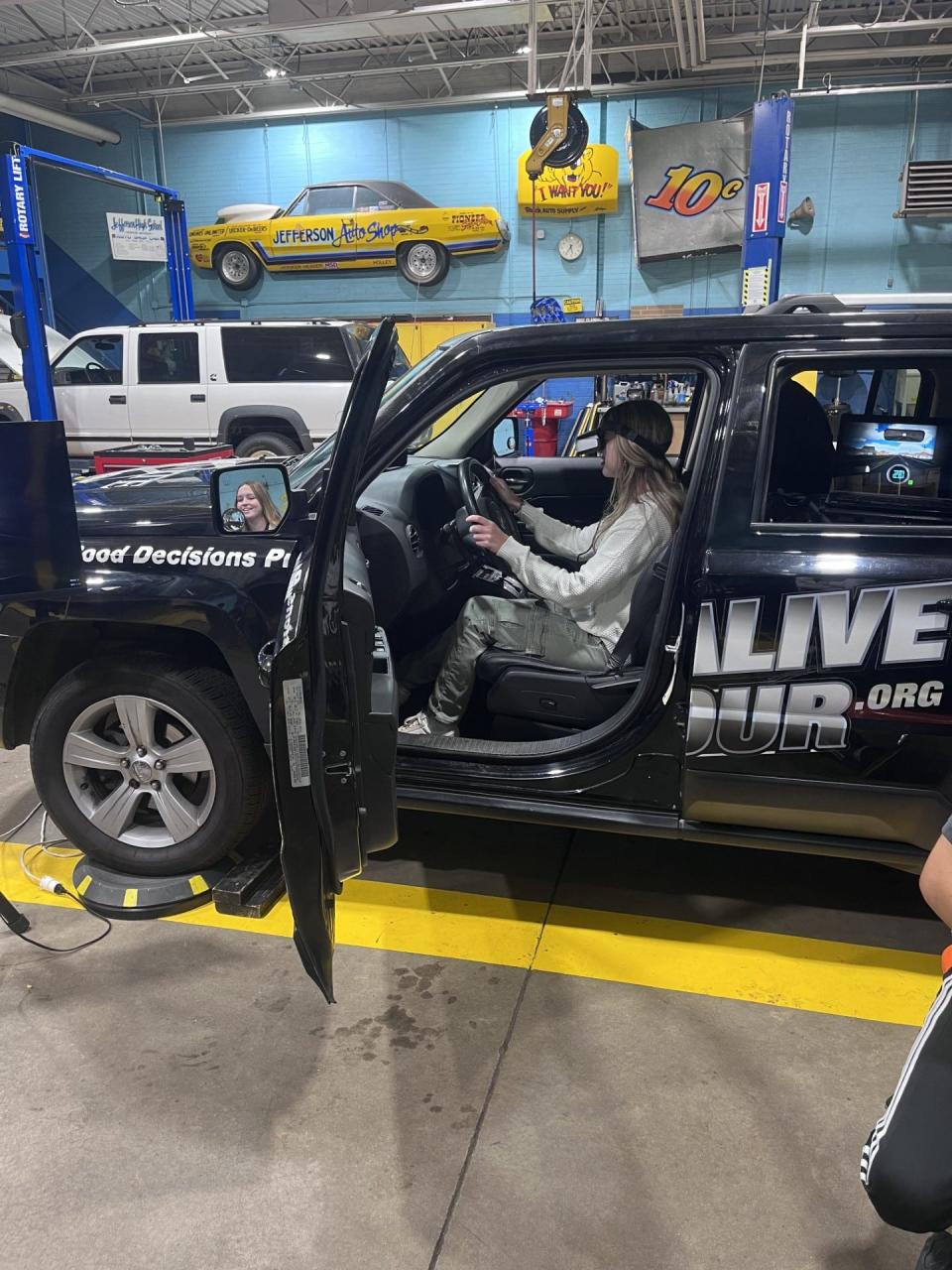 Student Katherine Scroi is shown in the Arrive Alive car earlier this week at Jefferson High School.