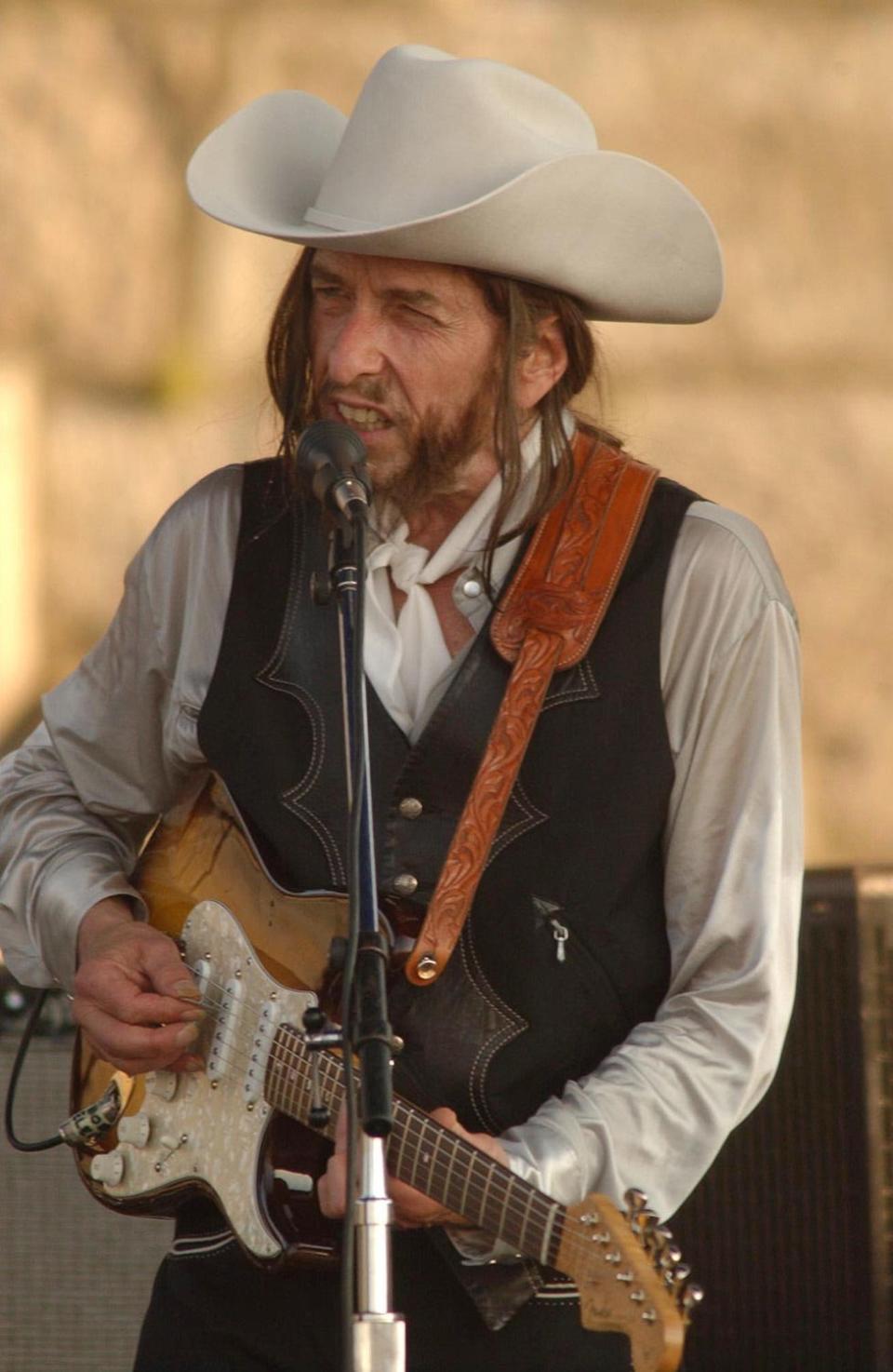 Bob Dylan performs at the Apple & Eve Newport Folk Festival in 2002.