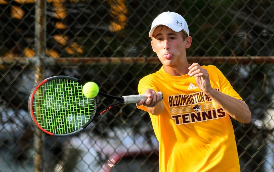 Bloomington North’s Connor O’Guinn hits a shot during his No. 2 doubles match during the Bloomington North-Bloomington South tennis match at Bloomington North on Tuesday, Sept. 6, 2022.