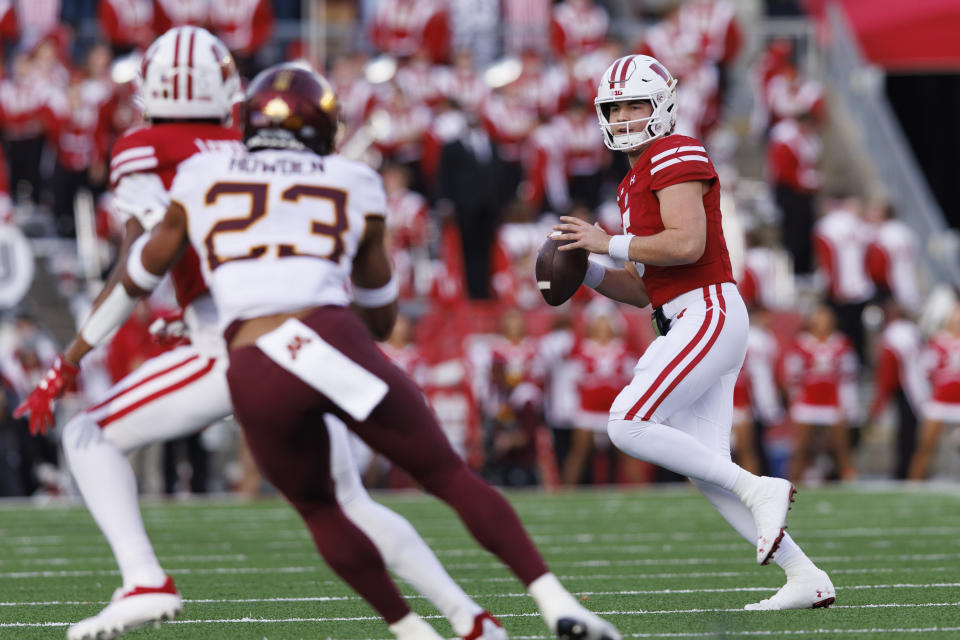 Nov 26, 2022; Madison, Wisconsin, USA; Wisconsin Badgers quarterback Graham Mertz (5) looks to throw a pass during the first quarter against the Minnesota Golden Gophers at Camp Randall Stadium. Mandatory Credit: Jeff Hanisch-USA TODAY Sports