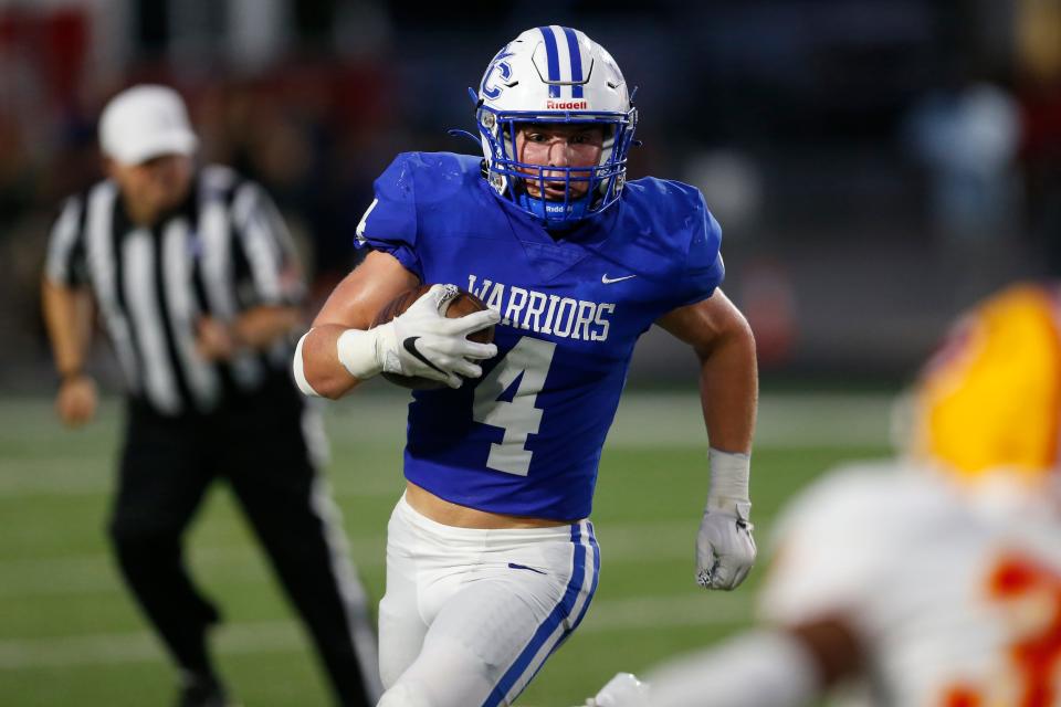 Oconee County's Whit Weeks (4) moves the ball during a GHSA high school football between Clarke Central and Oconee County in Watkinsville, Ga., on Friday Aug. 26, 2022. Oconee County won 33-9.