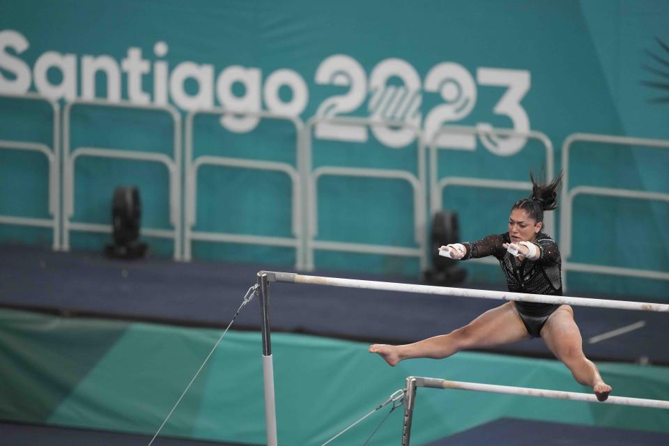 Argentina's Lucila Estarli competes on the uneven bars during the women's team artistic gymnastics final round at the Pan American Games in Santiago, Chile, Sunday, Oct. 22, 2023. (AP Photo/Martin Mejia)