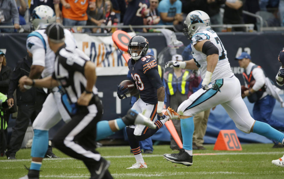 Chicago Bears safety Eddie Jackson (39) is chased by Carolina Panthers quarterback Cam Newton, left, and offensive tackle Matt Kalil after intercepting a pass by Newton for a 76-yard touchdown. (AP)