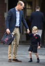 <p>The young royal strolled into his first day of school with his dad, Prince William, by his side on Sept. 7. (His mum, Kate Middleton, whose third pregnancy was announced earlier this week, has been home with acute morning sickness.) The 4-year-old, who will be known as George Cambridge by classmates, was greeted by the headmistress as he arrived in his summer school uniform. (Prince William was on backpack duty.) While this is George’s first day of real school, he previously attended a Montessori pre-school. (Photo: RICHARD POHLE/AFP/Getty Images) </p>