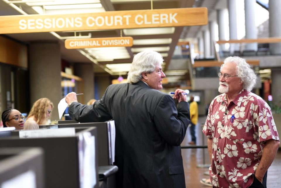 Attorney James A.H. Bell (left) talks with former Knoxville News Sentinel managing editor Tom Chester in 2016.