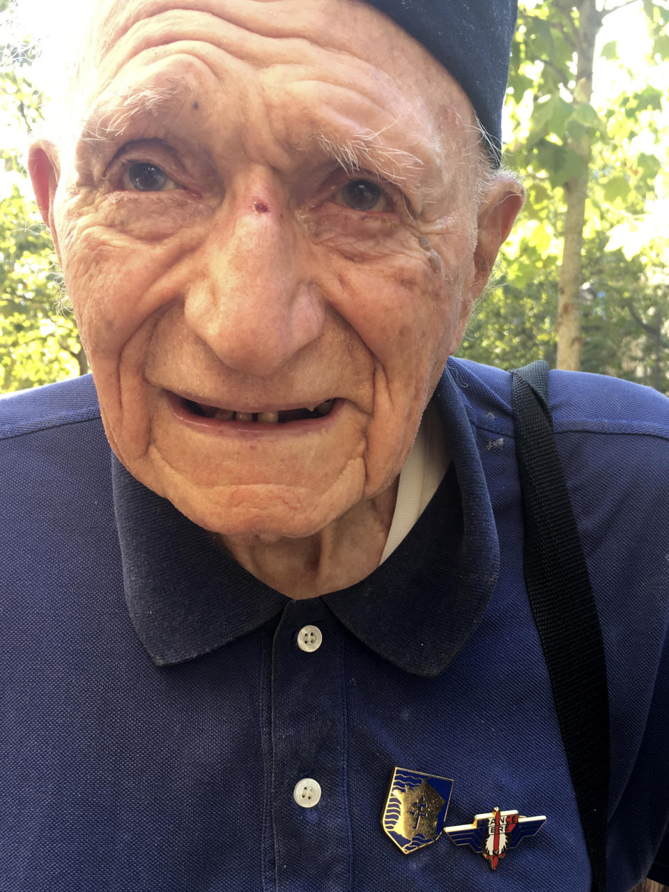 Roger Acher, 96, of France, arrives at a parade marking the 75th anniversary of the Liberation of Paris, Sunday, Aug.25, 2019 in Paris. Acher arrived in Paris near dawn Aug.25, 1944 with the 2nd armored division of Gen. Philippe Leclerc to liberate the city from four years of Nazi occupation. Paris is celebrating the French resistance fighters, American soldiers and others who liberated the City of Light from Nazi occupation exactly 75 years ago. (AP Photo/Elaine Ganley)
