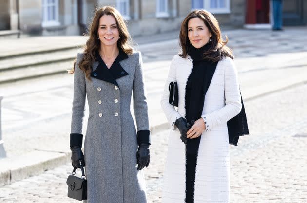 The Duchess of Cambridge and Crown Princess Mary of Denmark walk across the Amalienborg courtyard on Feb. 23 in Copenhagen, Denmark.  (Photo: Samir Hussein via Getty Images)