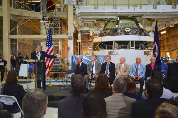 Robert Cabana, the director of NASA's Kennedy Space Center in Florida, presides over the July 21, 2014 ceremony to rename the center's historic Operations and Checkout Building for astronaut Neil Armstrong. Seated from left to right: Charles Bo