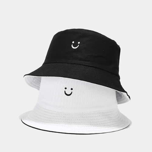 black and white reversible bucket hat with smiley face embroidery